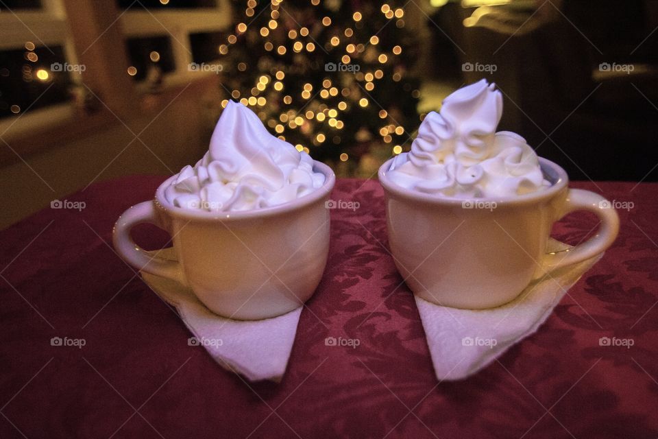 Pair of mugs with hot chocolate 