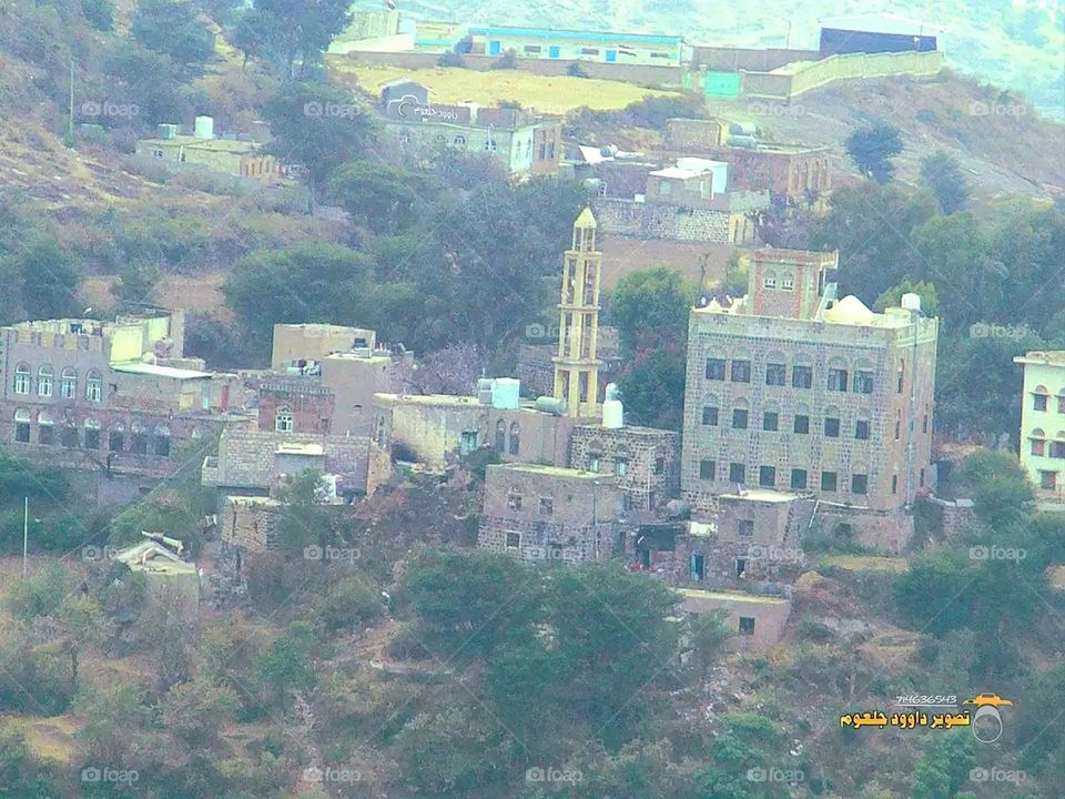 A stunning view of green mountains covered in fog in Yemen