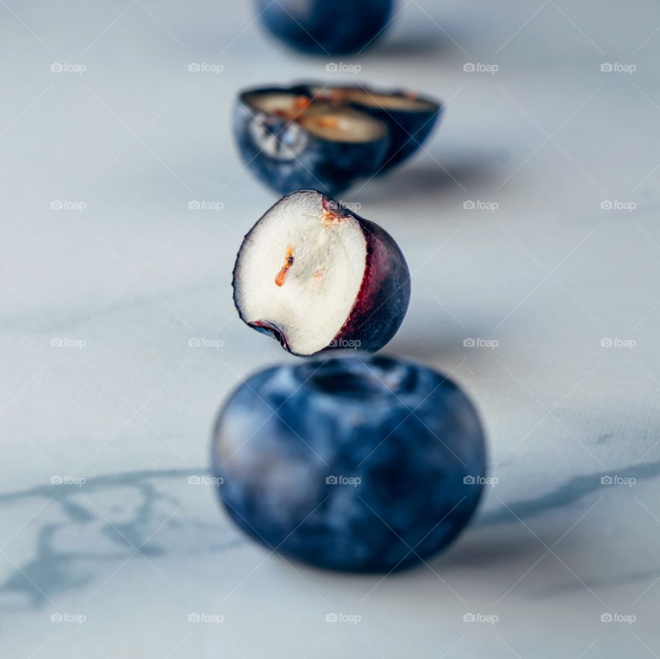 Close up fresh organic blueberries on a marble background 