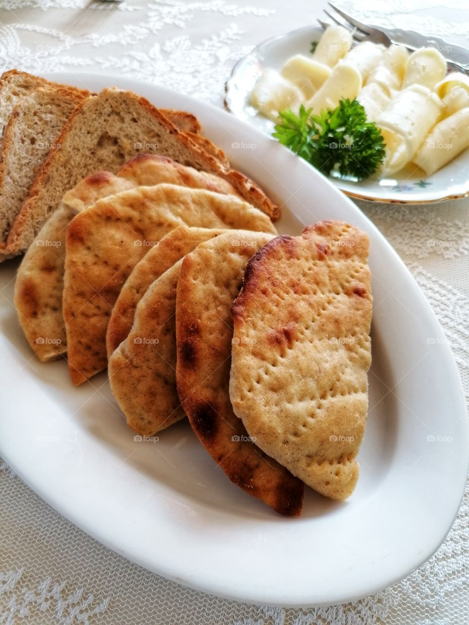 Finnish traditional potato bread we call potato "rieska". Served with butter and cheese. So tasty!