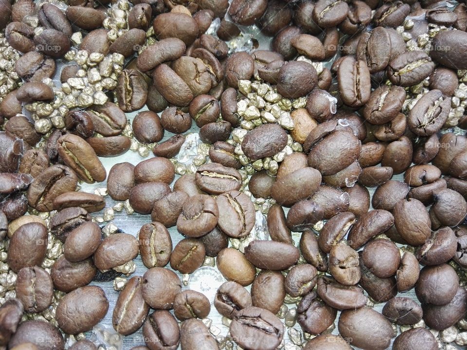 coffee beans with golden stones