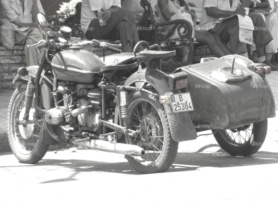 Cuba: Motorcycle and side car! As I see Santiago de Cuba in black and white, and sometimes in color! Cuba is a special destination and people know how to enjoy themselves, despite obvious signs of poverty and hardships. The streets are filled with vibrant colors and rhythm and it is not uncommon to see people dancing in the streets and alleys to the sound of loud salsa music! Wish I could, but It's impossible to capture it all! 