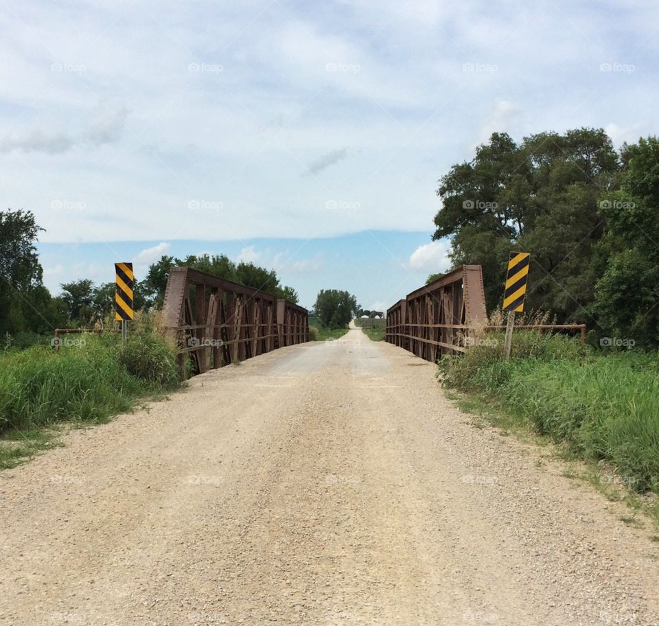 Pony truss bridge on rural Iowa gravel road 