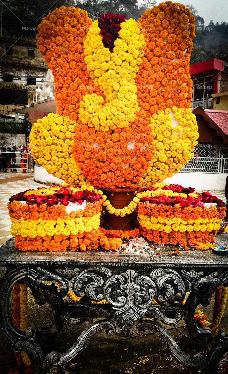 Lord Ganesha or God Ganesha Decorated with Marigold Flowers on occasion Of Famous festivals Ganesh Chathurthi in India.
