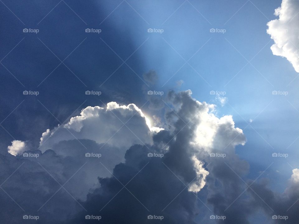 Sun shining through clouds