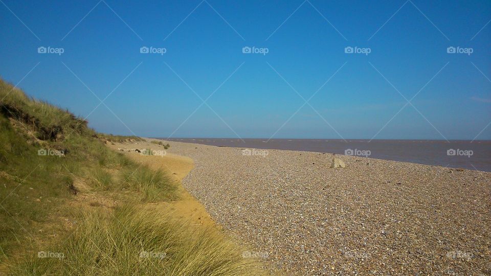 natural texture . sand,  stone,  sky and water