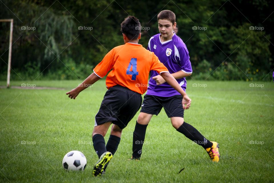 Kids are playing soccer