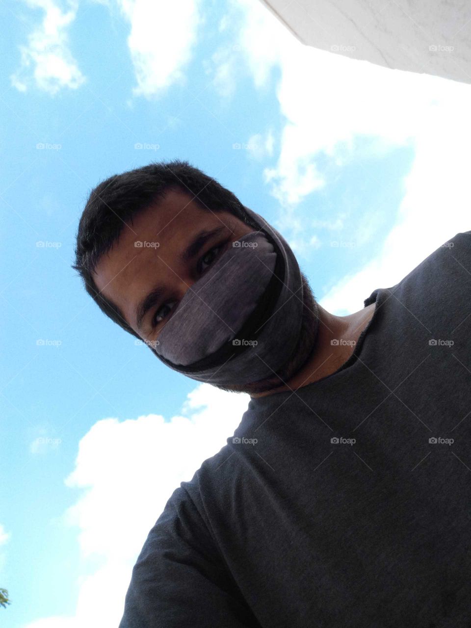 Man taking selfie with a spooky mask on