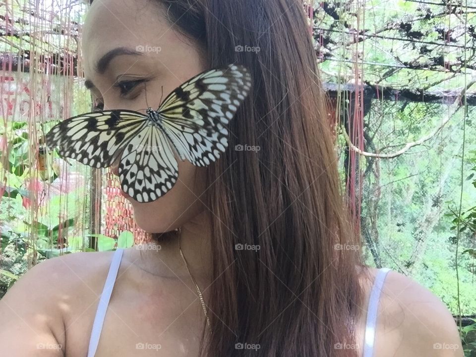A butterfly on a girl's face