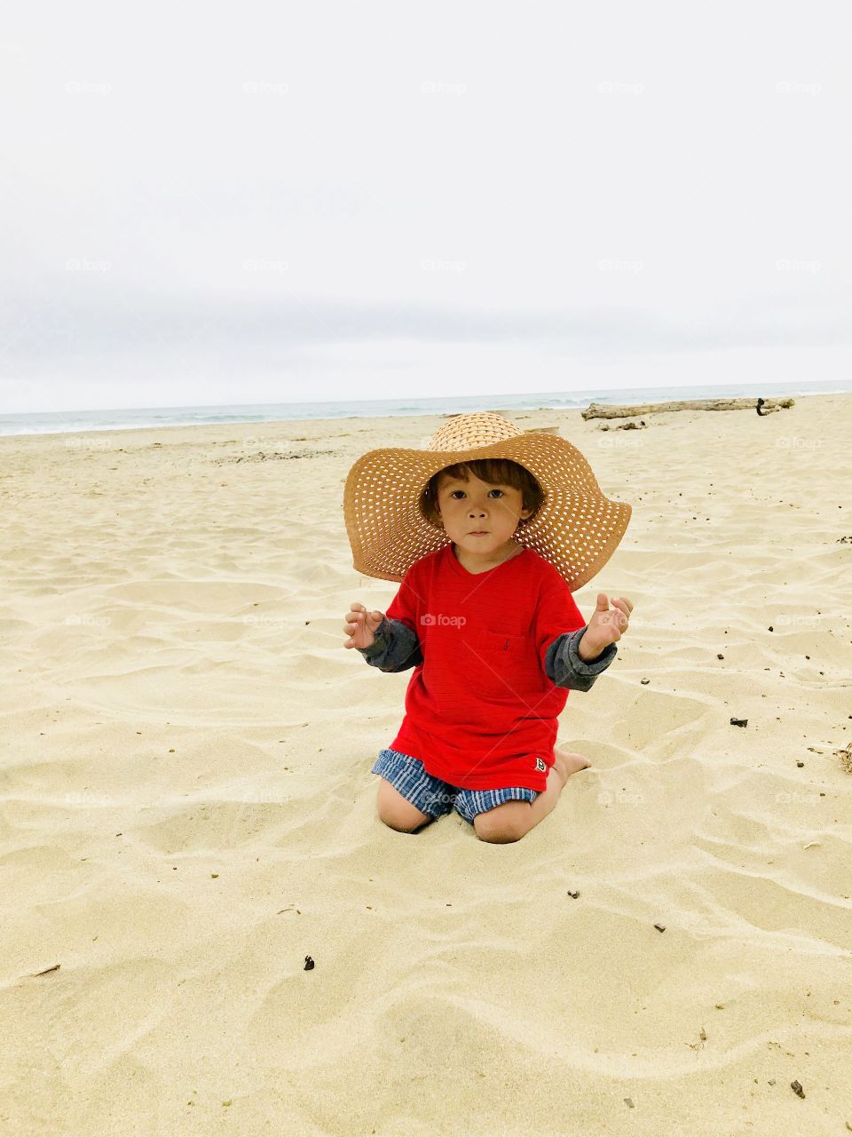 Awesome memories! With the hat and the sand at beach.