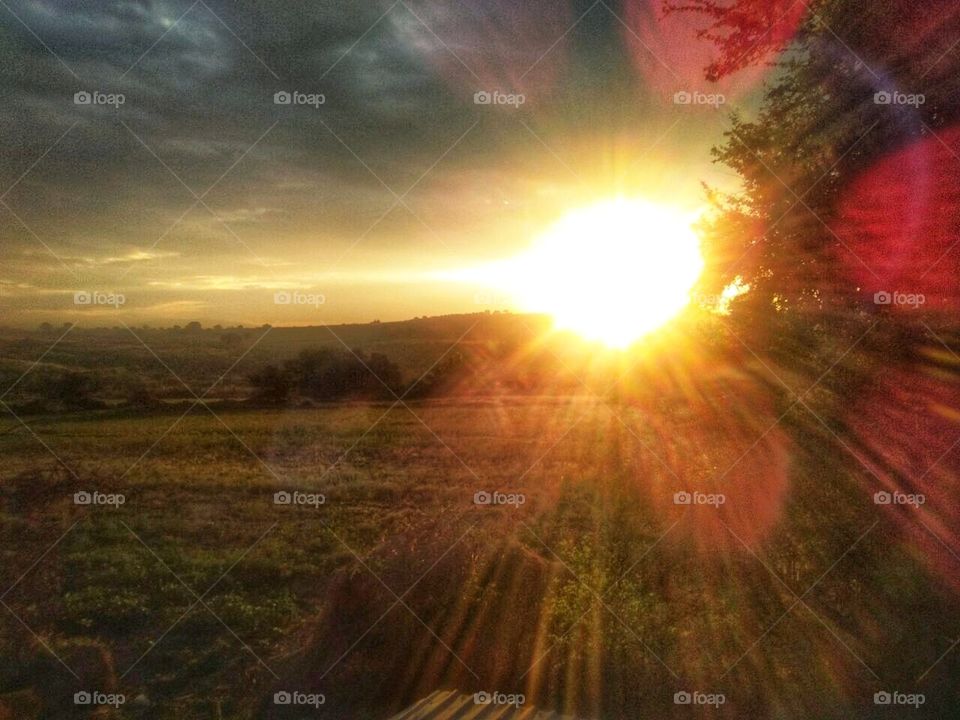 Sunset in the field,Sunset,field,countryside,rural,nature,landscape,colorful,sunlight,sunshine,shining,sky,clouds,cloudy,grass, farming,Mountain