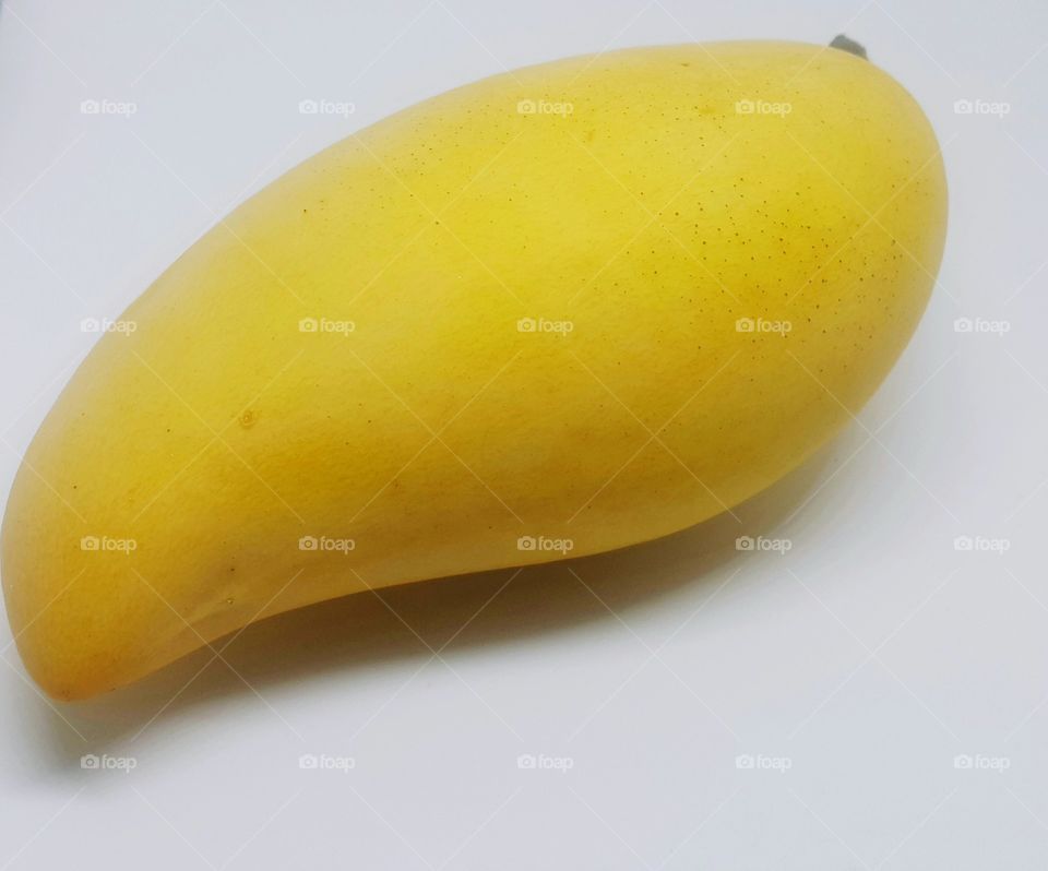 Closeup yellow mango,white background.