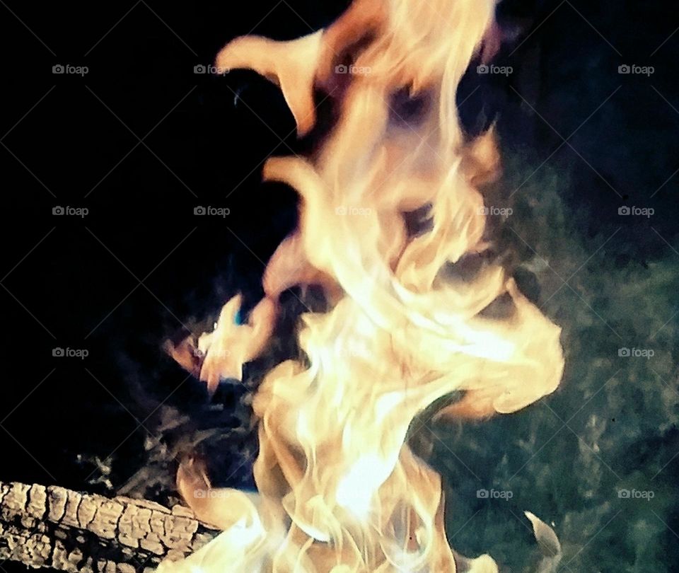 a photograph of a very hot smoking fire