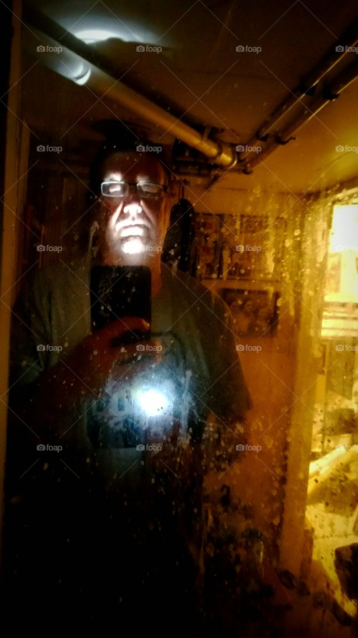 face reflection on glass