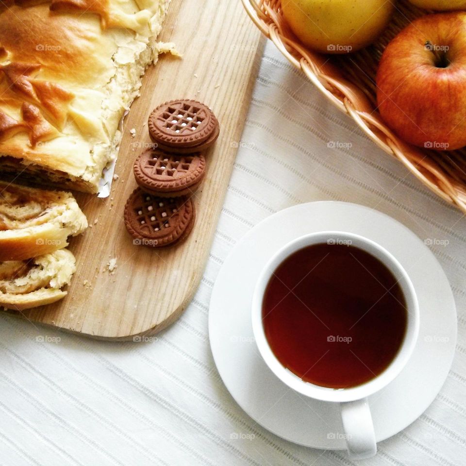 A cup of tea with biscuits