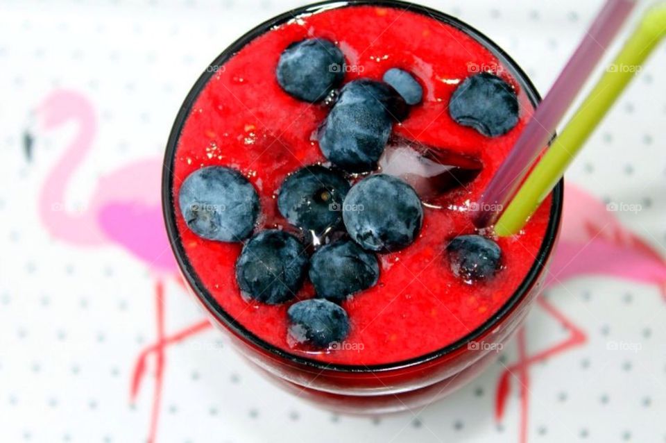 Smoothie with red fruit and blueberries