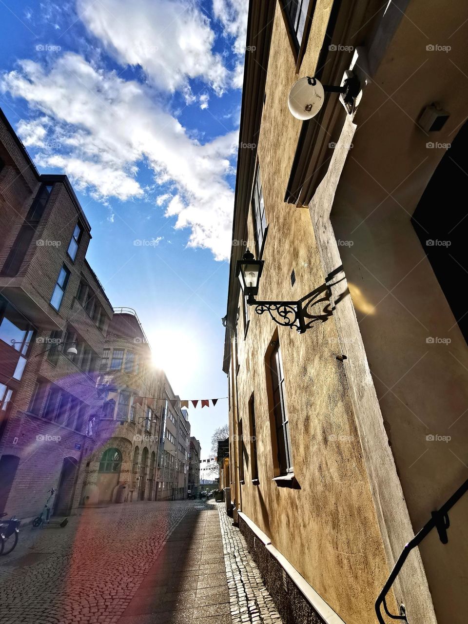 Cobblestone street and old houses in the city