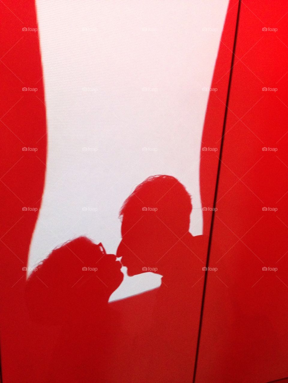 Silhouette of couple kissing