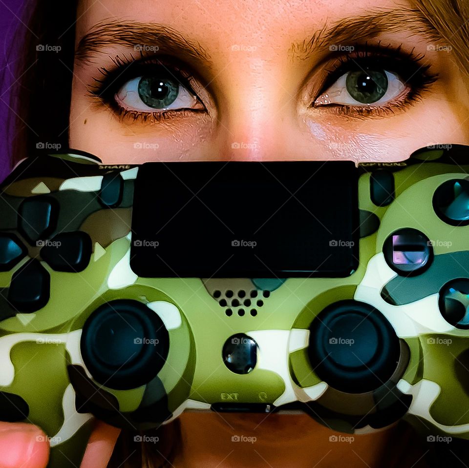 Gamer girl showing her controller