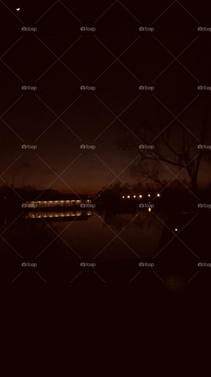 Dark Night is Upon Us,Gleaming Lights from Shore Line, Other Lights from Neighbored Buildings. Fading Horizon hives way to Night. 