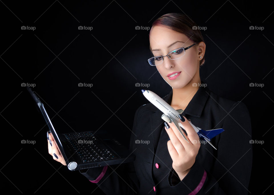 Girl With Model Airplane and Laptop