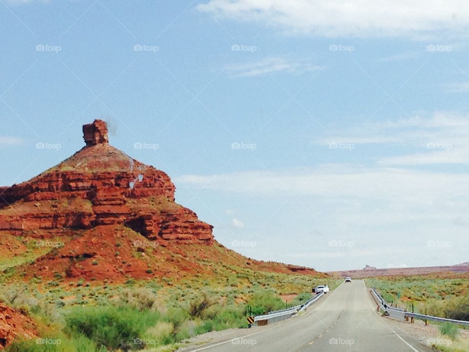 High red rock beside the road leading to the monument valley