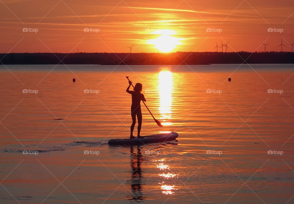 Stand up paddling in the sun