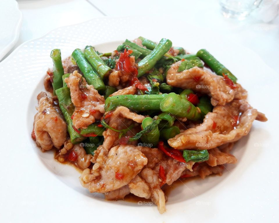 Stir-fried pork with basil leaves.