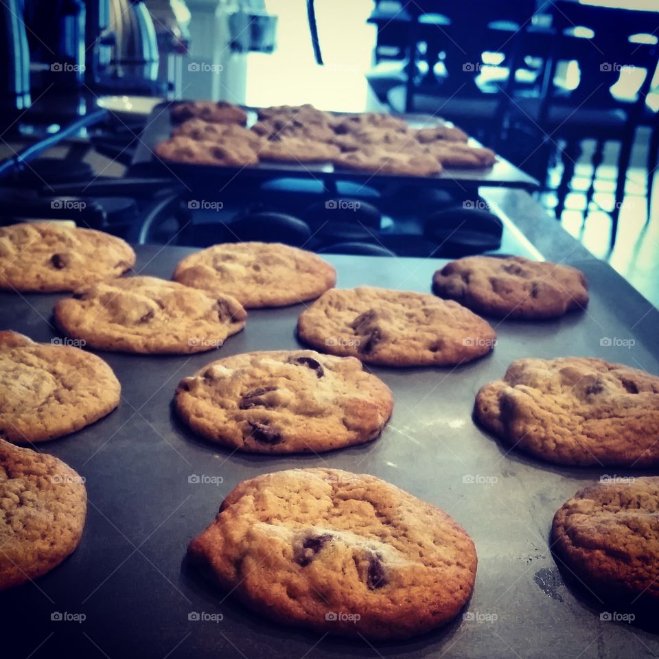 Chocolate Chip Cookies on Cookie Sheet on Gas Range Top