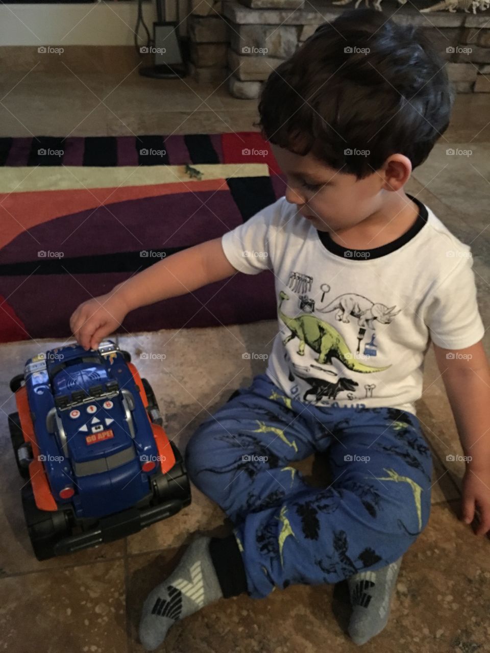 Boy playing with toy truck