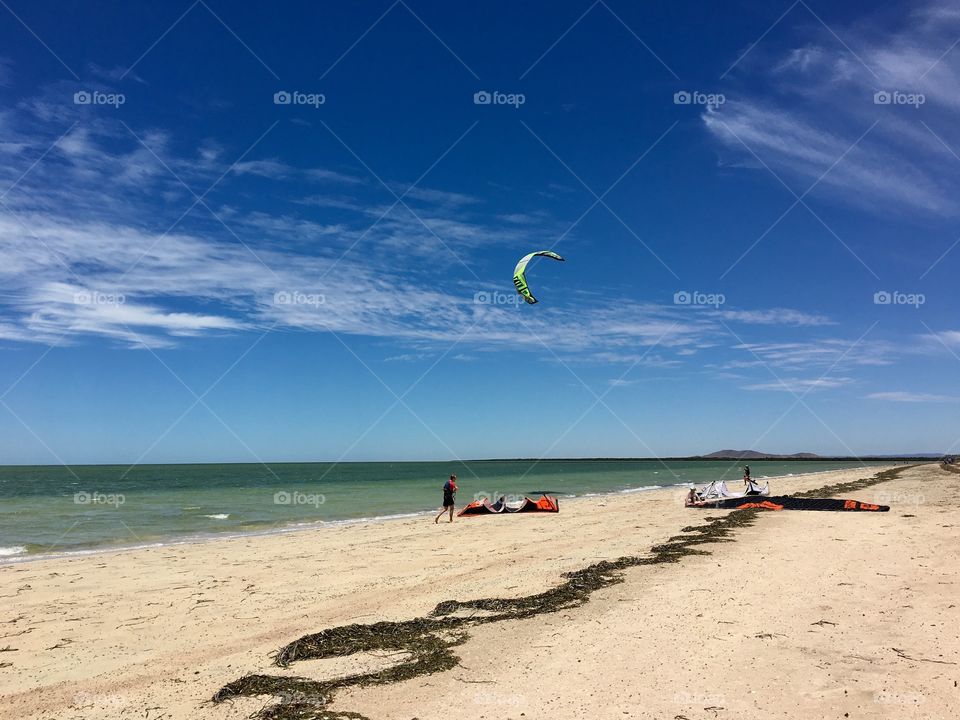 Kiteboarding on the ocean on a windy day