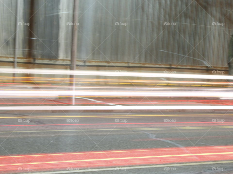 Car lights speeding past creating a long exposer shot.