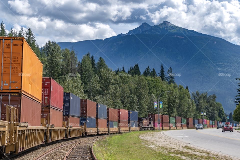 Cargo train rolls through mountain town