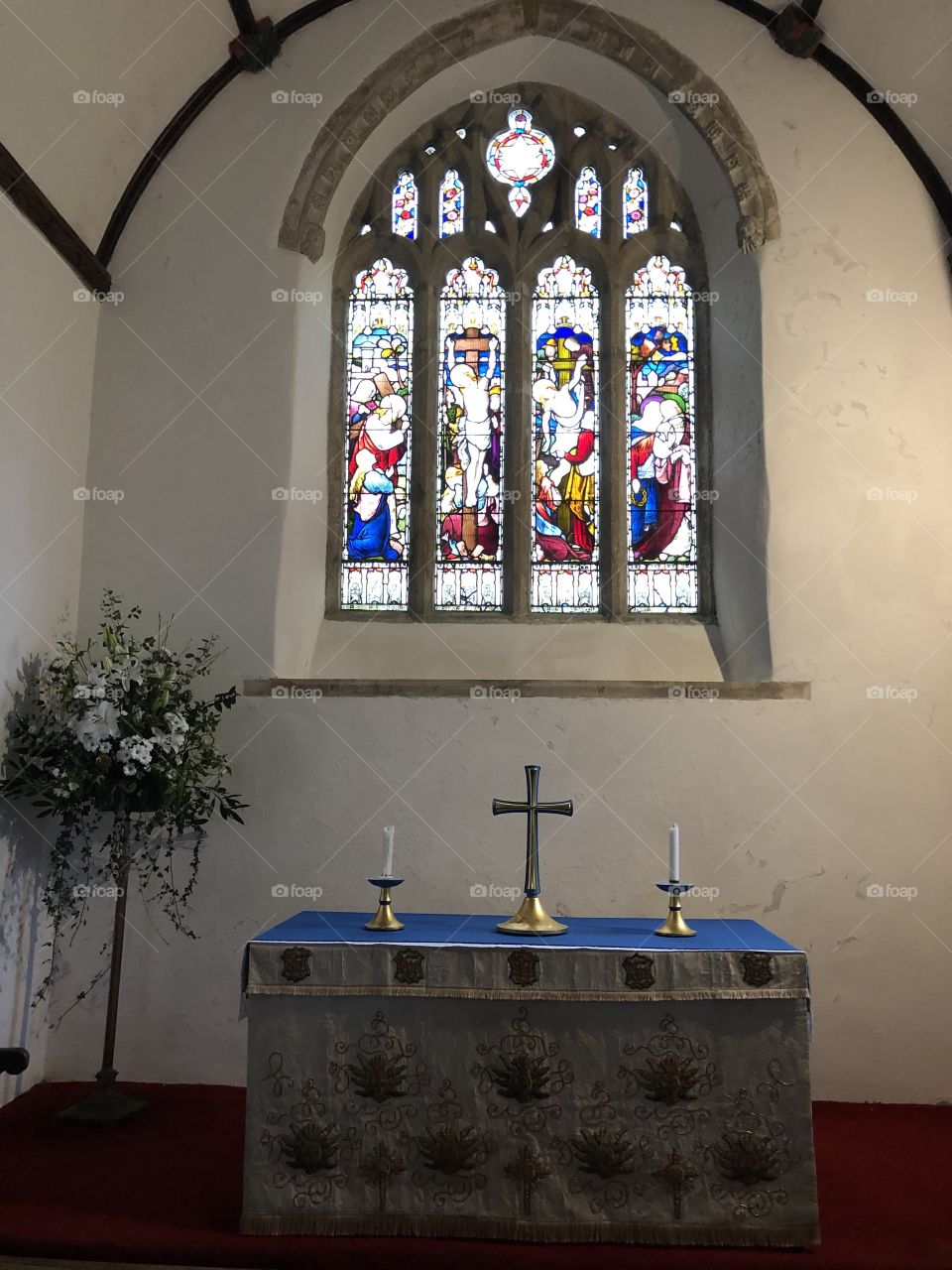 A second stained glass window and chapel associated with St Pancras Church at Widecombe-in-the-Moor on Dartmoor, UK