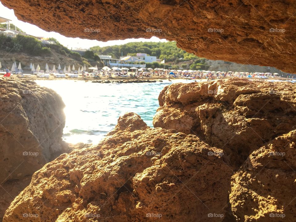 Beach view through the rocks