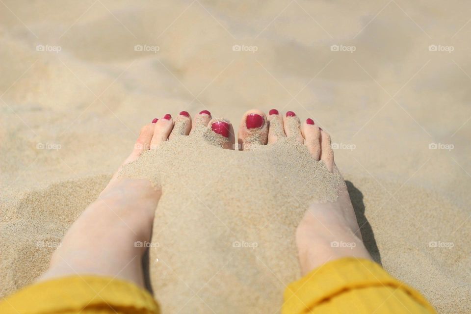 Sand on the foots