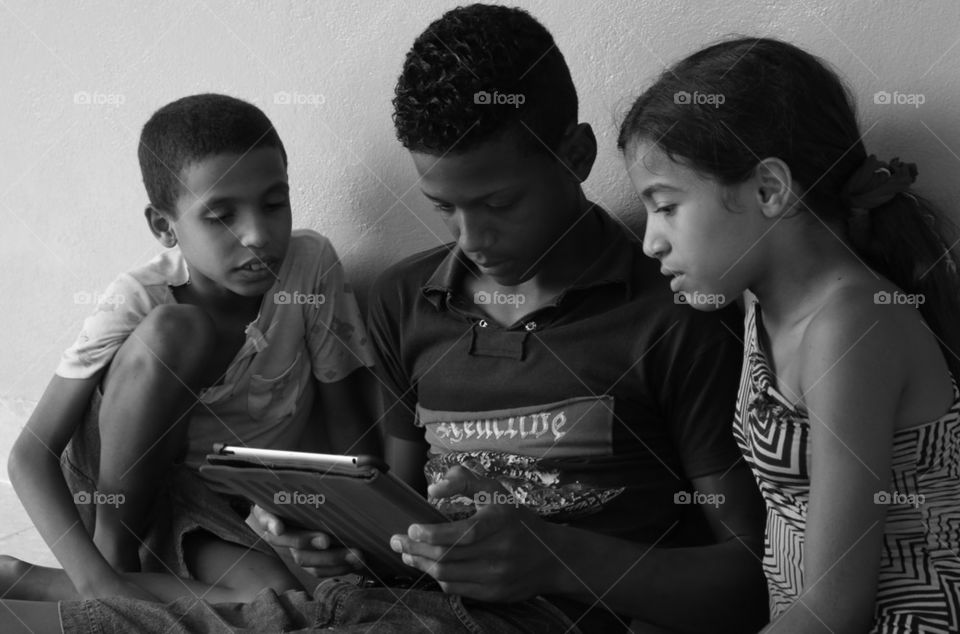 Cuban Children With iPad
