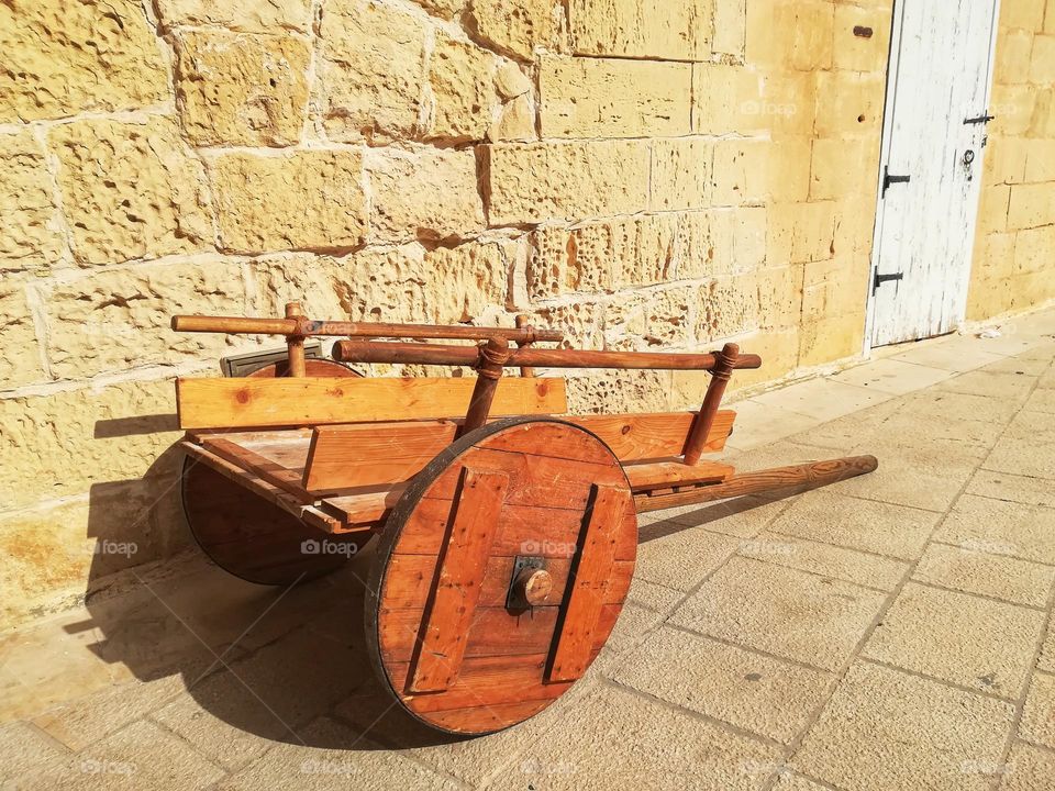 ancient cart parked in the alleys of the mdina in Malta