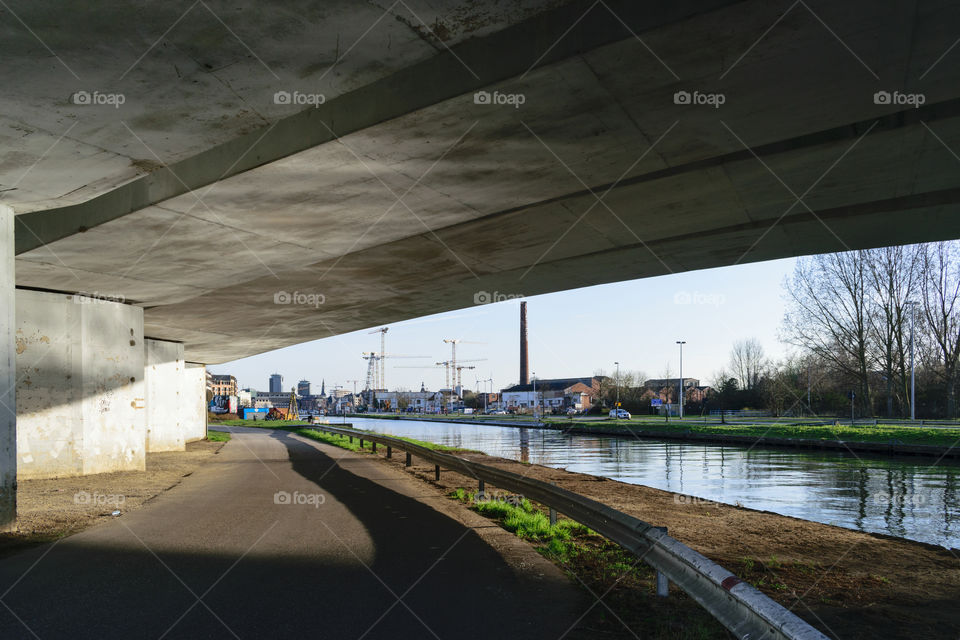 under the bridge away from the city