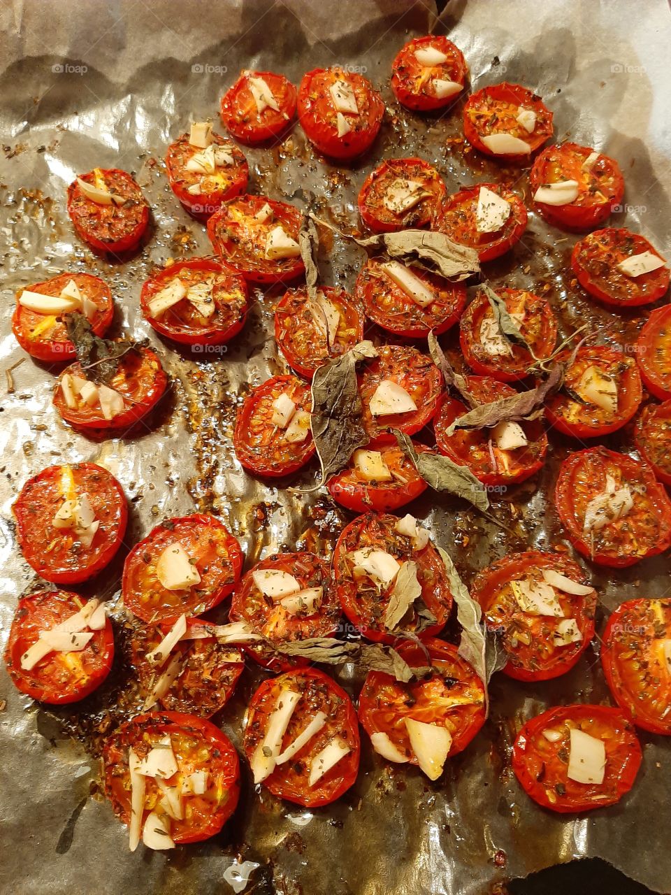 sun-dried tomatoes with herbs in parchment paper