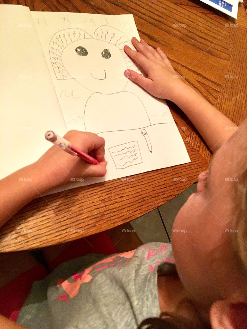 Girl drawing self portrait
