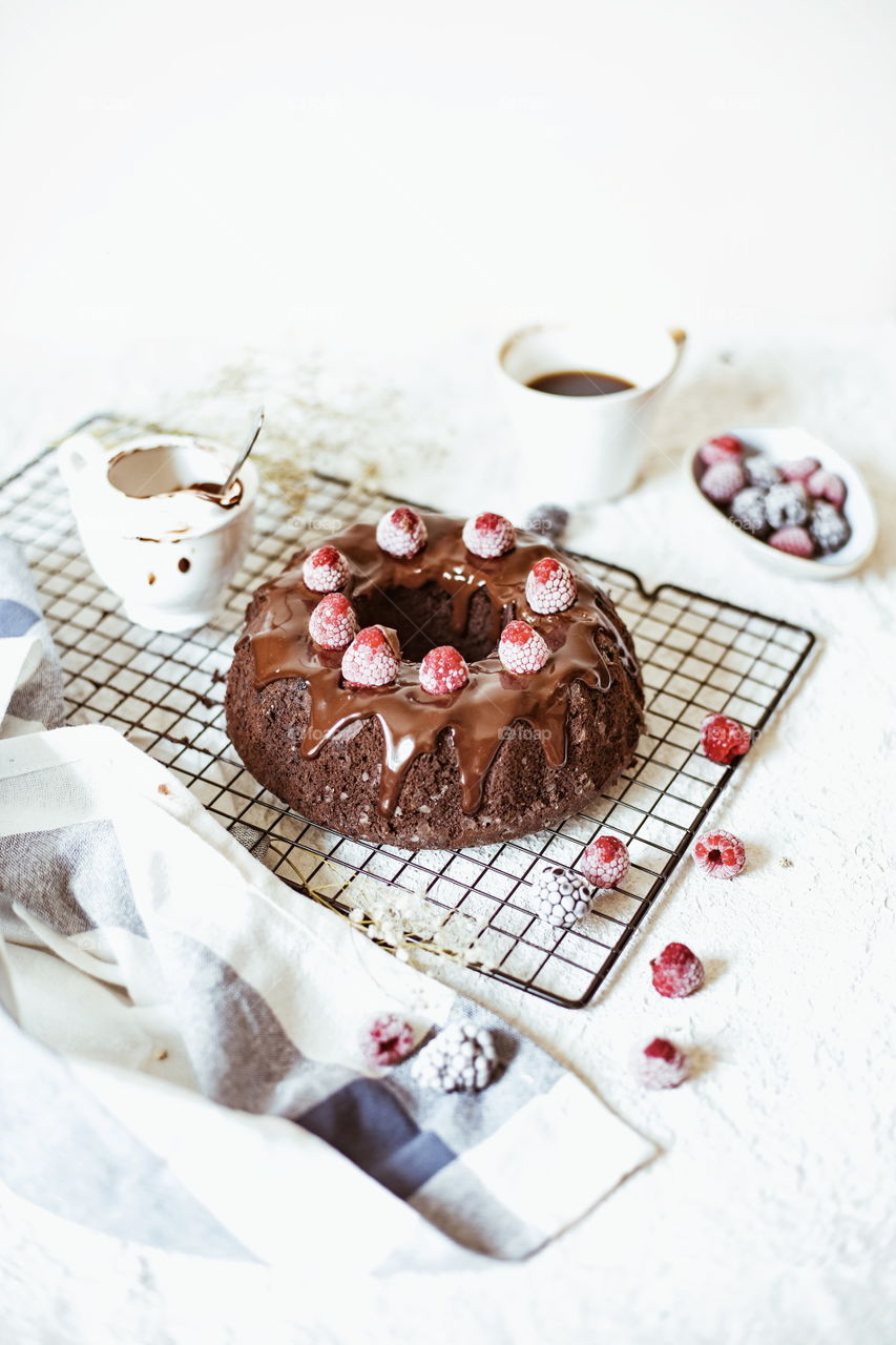 chocolate brownie cake with chocolate mousse and raspberry on the top food photography