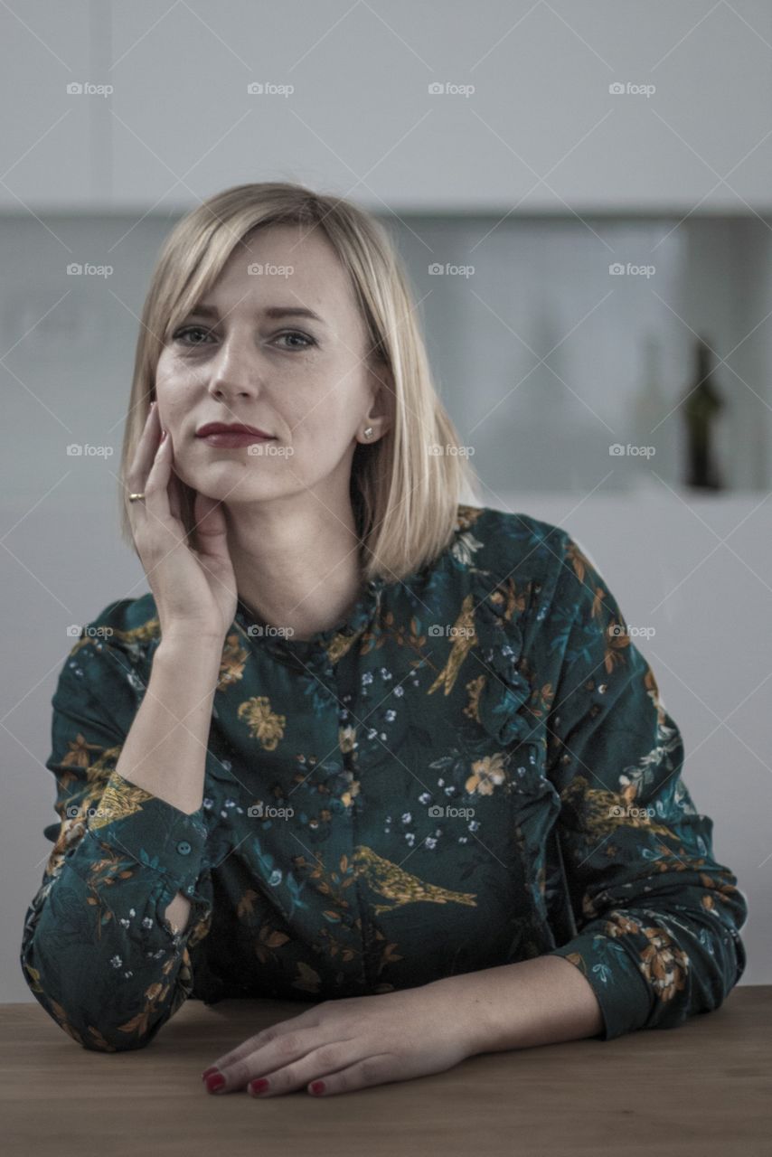 Portrait photo of a young woman in a green shirt