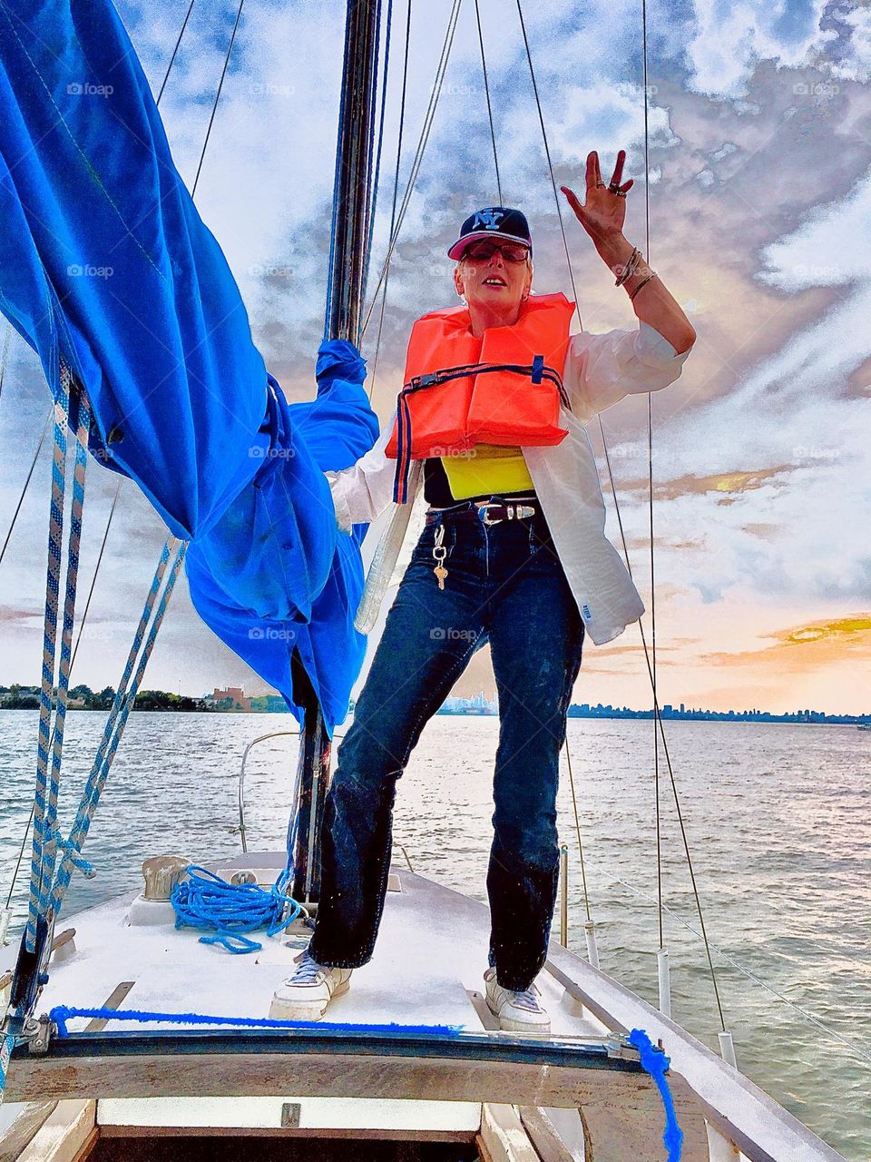 An enthousiastic Petra Schiller standing on the deck of the newly purchased sailboat “Salvation” giving the “Victory” sign. The journey by sea to Newtown Creek in LIC, Queens is still ahead. 2017. Hypnotic Productions