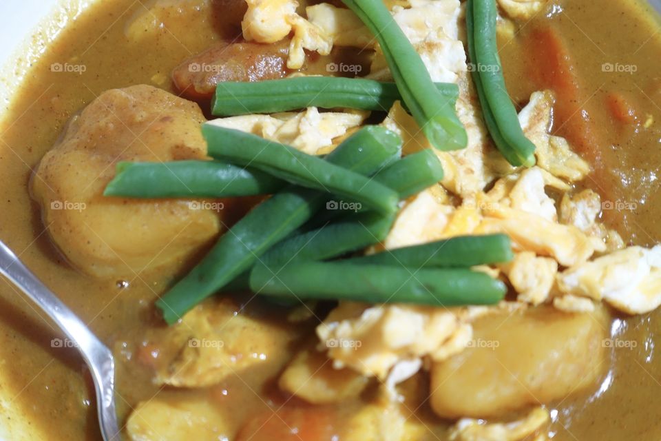 Homemade Chicken Curry ( Ingredients: curry powder, chicken, green beans, potato, carrot, egg and onion).