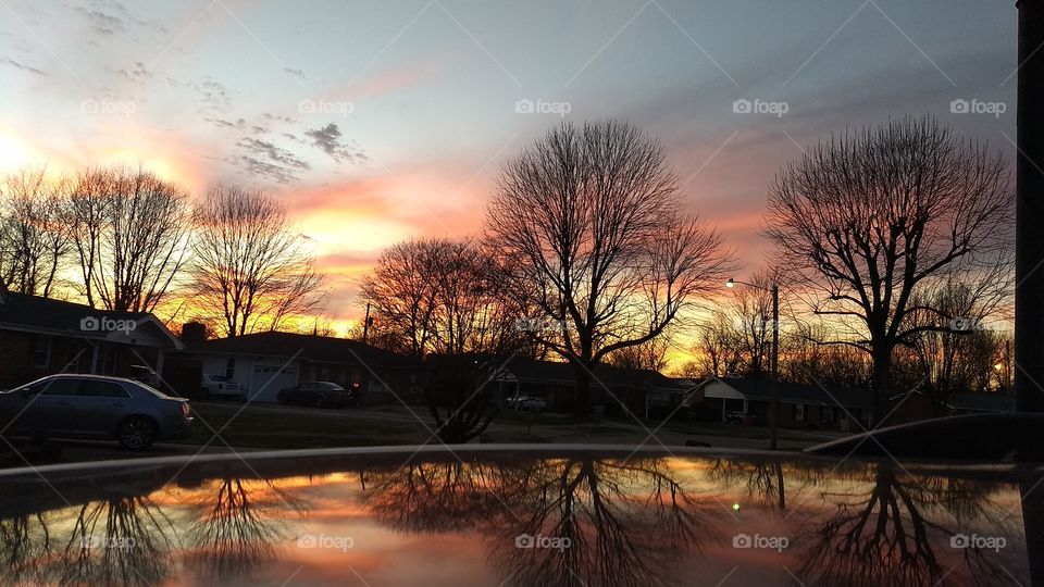 Sunset just now, viewed from my front yard over the top of my van