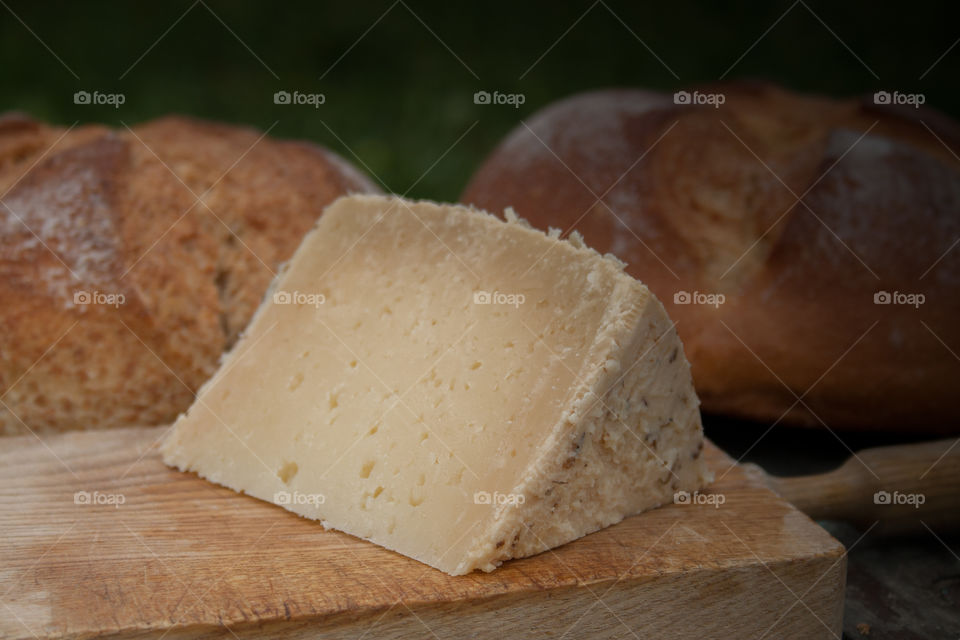 Cheese on the table with bread