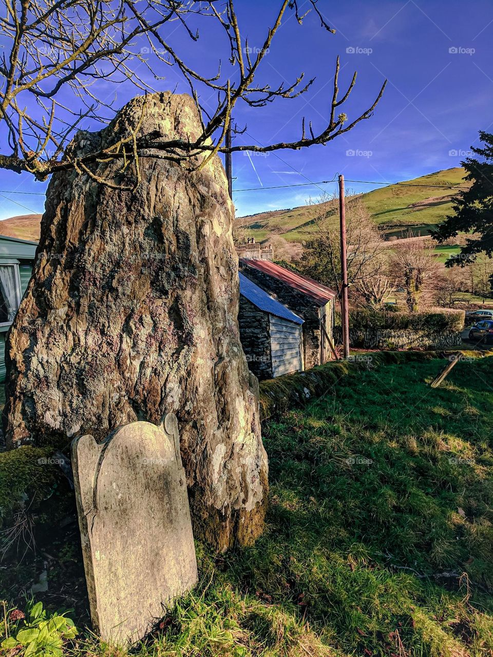 Standing stone and gravestone in Wales