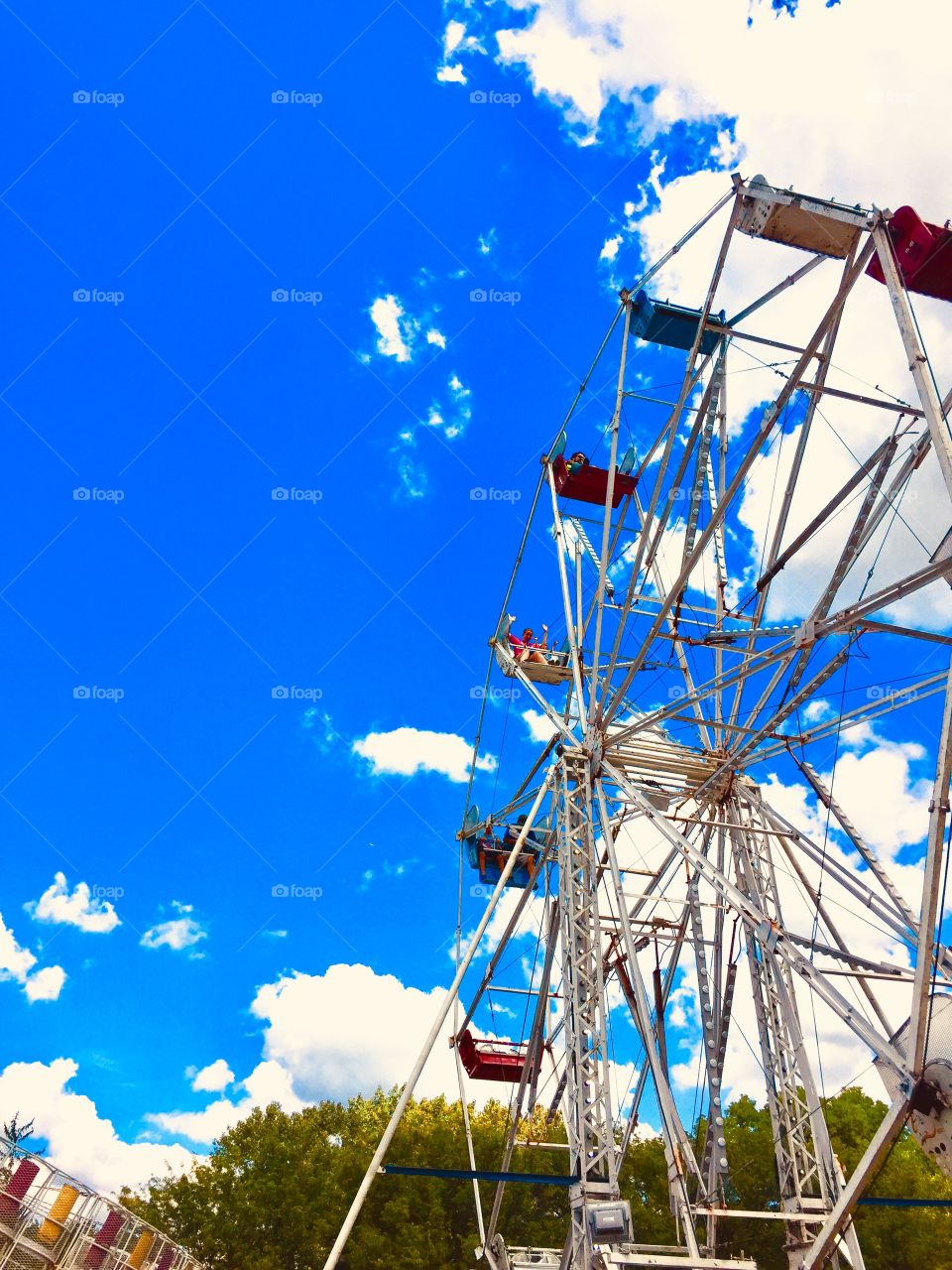 Ferris wheel fun at the local carnival ride making summer memories with the kids