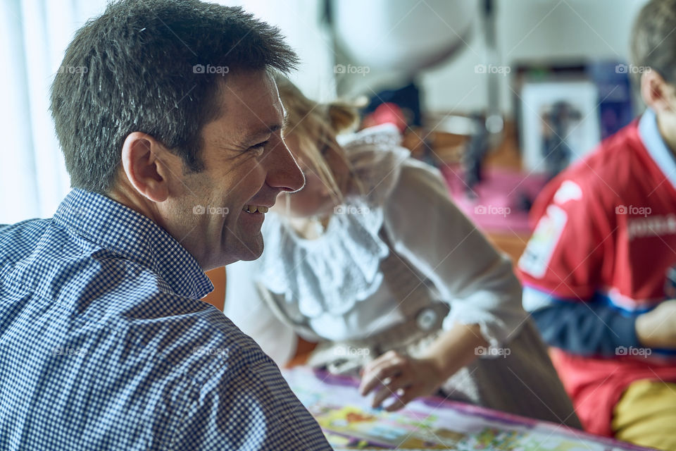 Side view of a man smiling